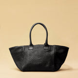 The Shoulder Bag ORIGINAL by LABEL17 is a timeless piece, crafted from fine, vegetable-tanned nappa leather and hand-braided. It features a zipper closure and a convenient interior pocket for your essentials.