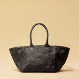 The Shoulder Bag ORIGINAL by LABEL17 is a timeless piece, crafted from fine, vegetable-tanned nappa leather and hand-braided. It features a zipper closure and a convenient interior pocket for your essentials.